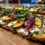 Peach and Prosciutto Flatbread with Goat Cheese and Arugula