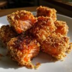 Close-up of Irresistible Crispy Bang Bang Salmon Bites, showing the flaky salmon and crunchy coating.
