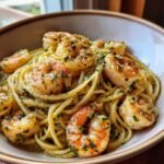 A close-up of Delicious Garlic Shrimp Pasta, featuring perfectly cooked shrimp and linguine coated in a savory garlic sauce and fresh parsley.
