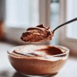 A spoonful of light and fluffy Irresistible Chocolate Mousse Recipe, ready to be enjoyed.