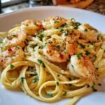 Close-up of Irresistible Creamy Garlic Shrimp Pasta with fettuccine, plump shrimp, and fresh parsley.
