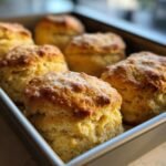 Golden brown, fluffy Irresistible Breakfast Butter Swim Biscuits baked in a square pan.