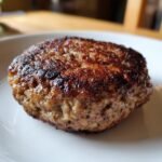 Close-up of a beautifully seared, caramelized patty for an Easy Black Bean Burgers recipe.