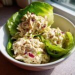Close-up of creamy chicken salad served in crisp lettuce cups, a perfect Gluten Free Lunch Idea.